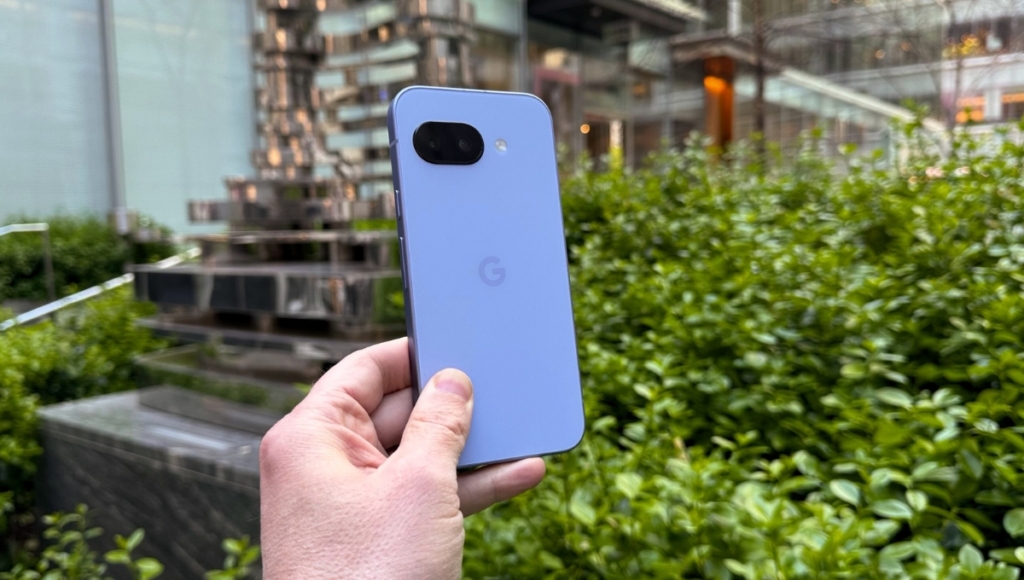 Google Pixel 9a smartphone showing front display and dual rear camera with 13MP selfie camera and 48MP main lens